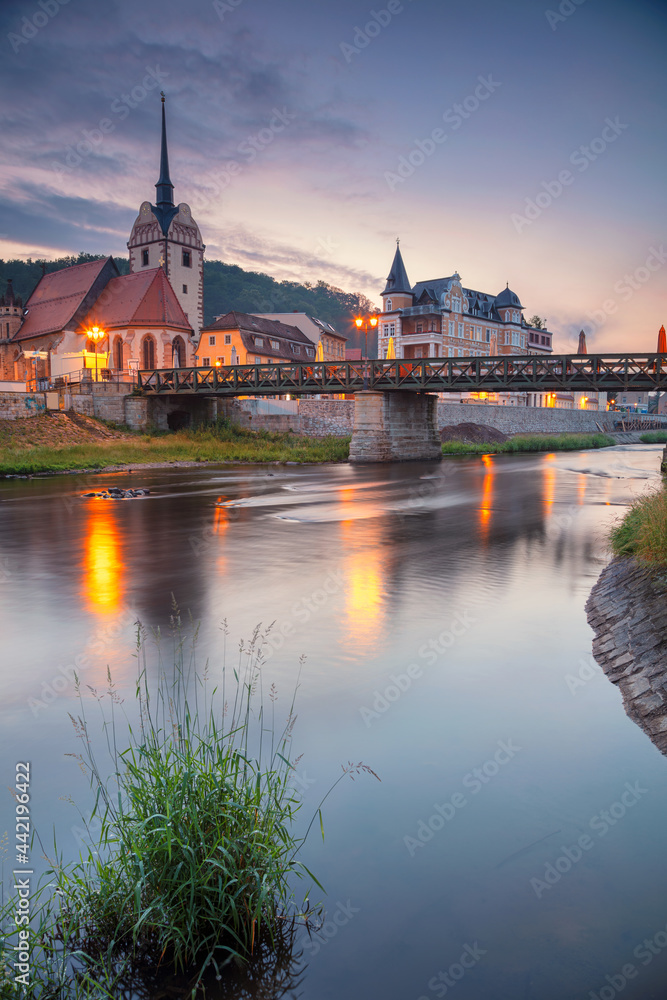 Gera, Germany. Cityscape image of old town Gera, Thuringia, Germany with St. Mary's Church and Untermhaus Bridge over White Elster River at sunset.