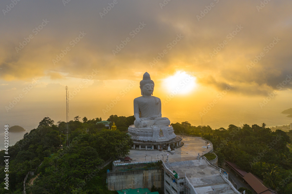 aerial view scenery yellow sun with rain clouds moving summer..beautiful Phuket big Buddha on the top of mountain.. Another incentive to attract tourists to visit. popular landmark of Phuket
