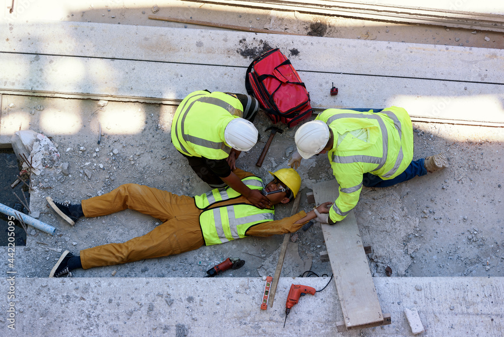 Check Response and pulse, Life-saving and rescue methods. Accident at work  of builder worker at Construction site. Heat Stroke or Heat exhaustion in  body while outdoor work. First aid basic concept. Stock