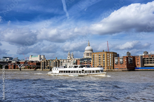 Pleasure boat sailing down the Thames River, London