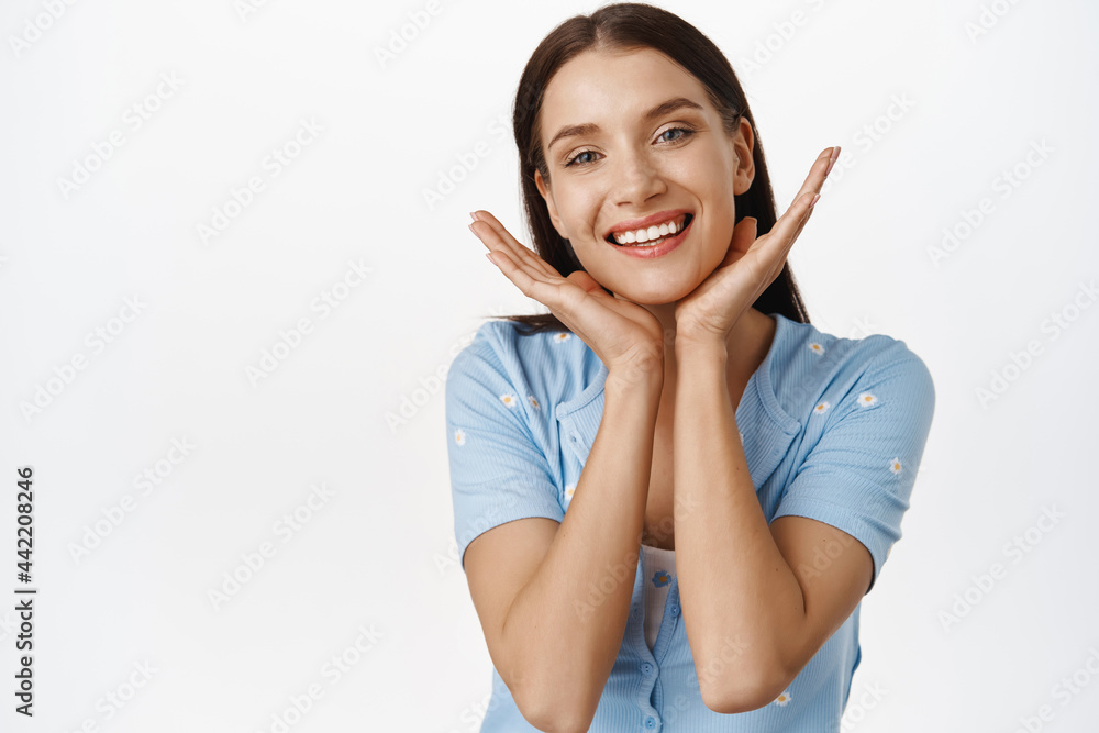Beauty and women skincare. Young glowing woman in 30s, showing her natural healthy, perfect skin without makeup, no wrinkles, anti-aging effect of cosmetic procedure, smiling happy at camera Beauty and women skincare. Young glowing woman in 30s, showing her natural healthy, perfect skin without makeup, no wrinkles, anti-aging effect of cosmetic procedure, smiling happy at camera
