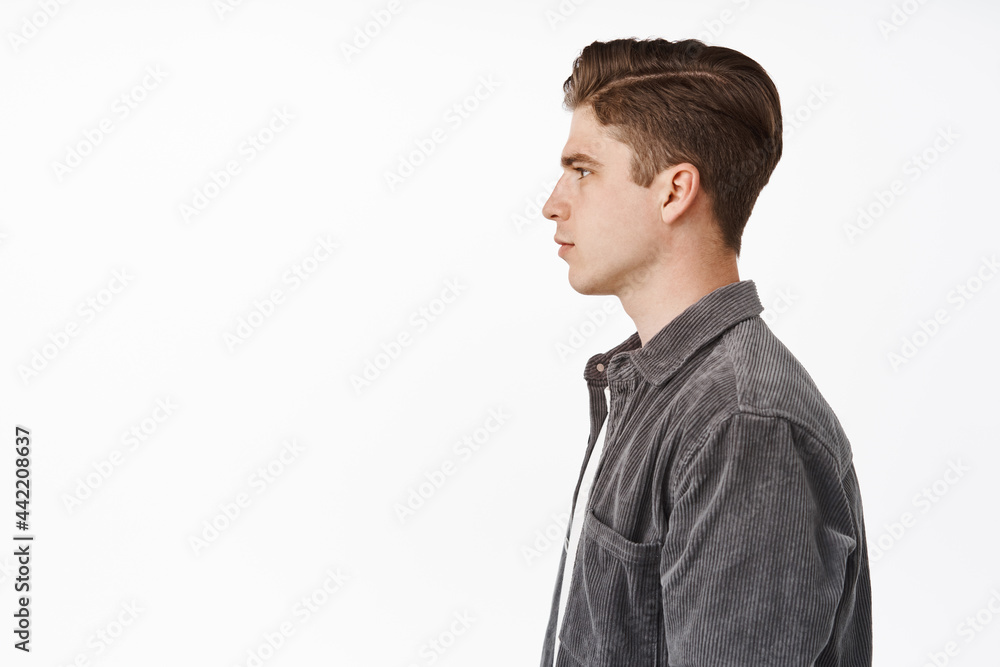Profile Shot Of Young Serious Man Teenage College Student Looking Left 
