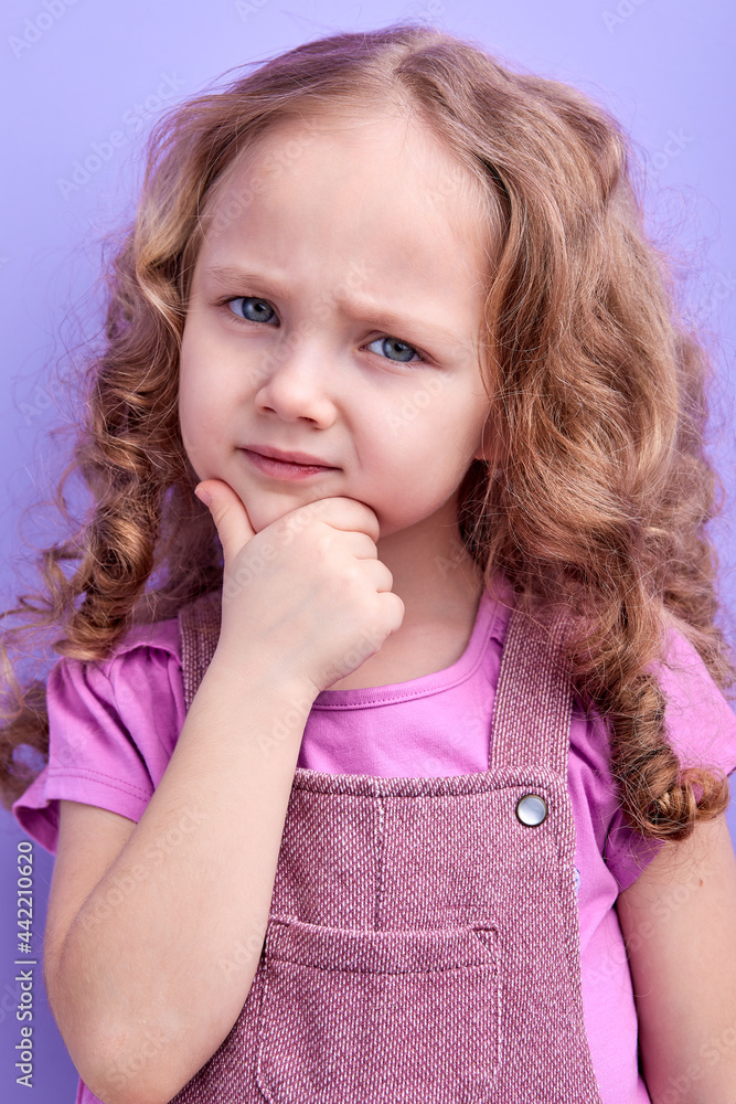 Close-up portrait of nice lovely cute minded girl thinking touching chin, thinking sly eyes creative intelligent person wear casual clothes isolated purple color background Close-up portrait of nice lovely cute minded girl thinking touching chin, thinking sly eyes creative intelligent person wear casual clothes isolated purple color background