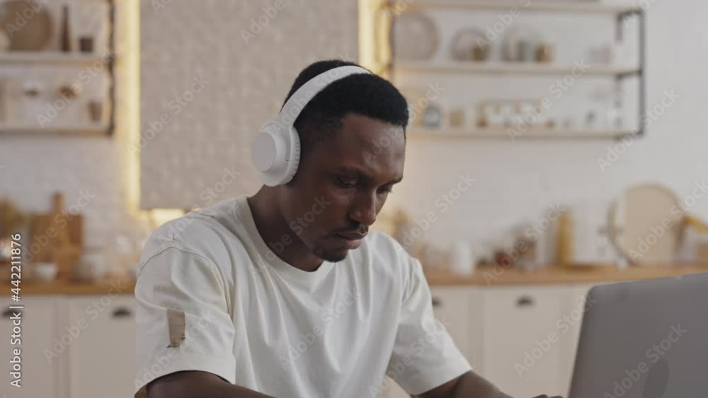 African american man using laptop for studying online African american man using laptop for studying online