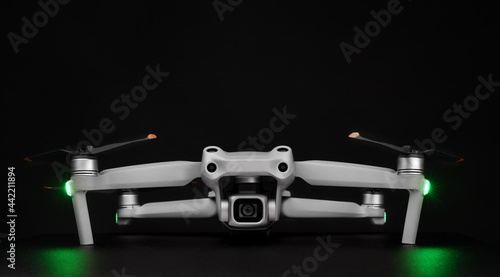 Front View on the drones gimbal and camera - professional drone - isolated on black background.