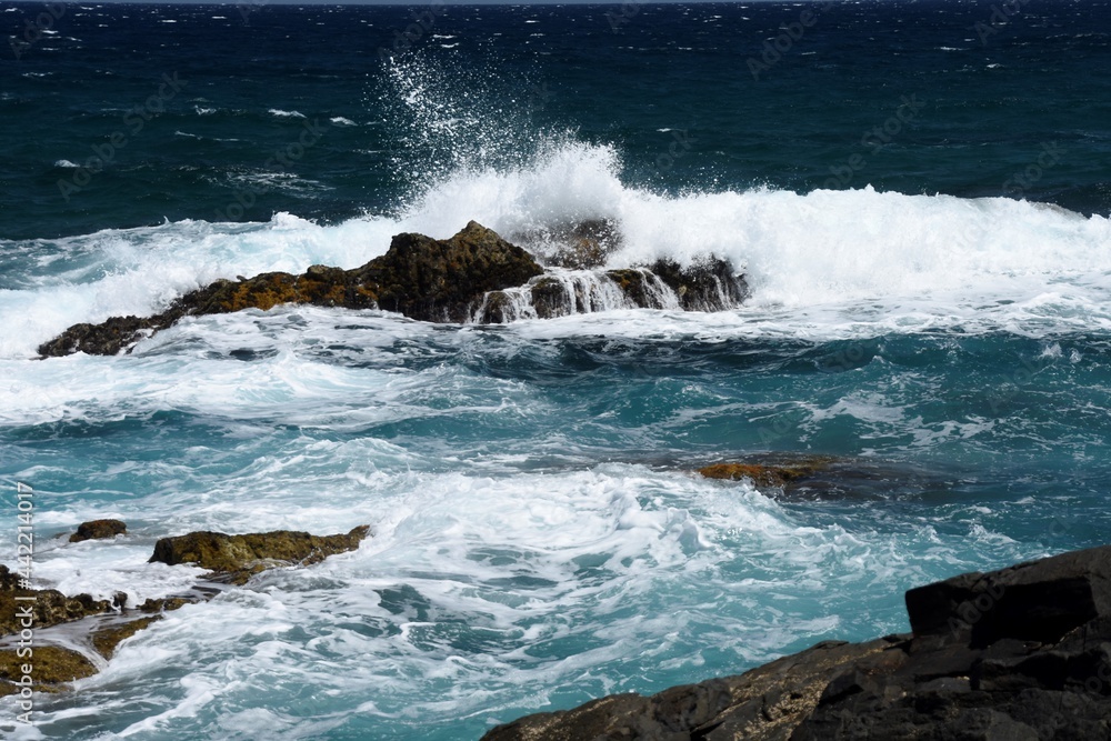 yhe waves crashing on the rocks yhe waves crashing on the rocks