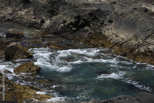 yhe waves crashing on the rocks