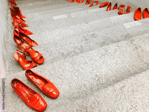 Bilde på lerret Red shoes on grey steps.