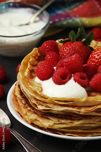 Russian cuisine national dish bliny with fresh berries