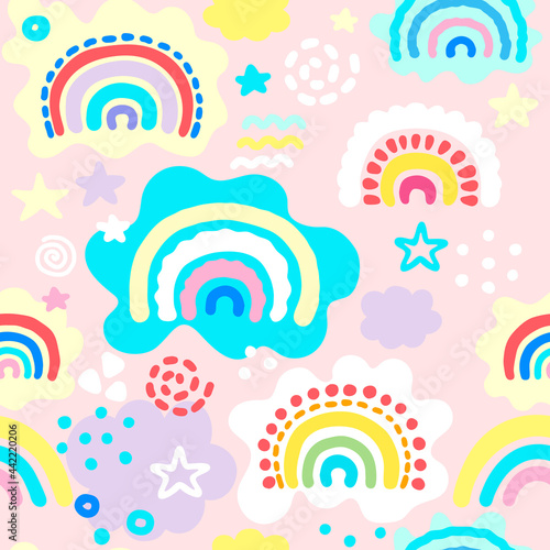 Seamless pattern with hand drawn rainbows, dots and clouds in pastel colors. Kids texture for fabric, wrapping, textile, wallpaper. Cartoon Vector Illustration.