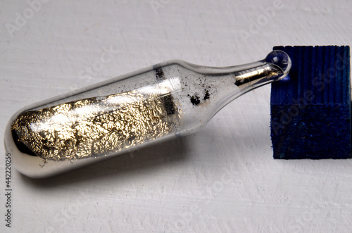 Sample of the Alkali metal Caesium, element number 55. This reactive metal can only exist in a sealed glass ampoule