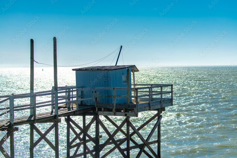 Royan in France, typical huts on stilts on the coast
