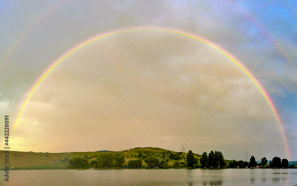 Landscape with a semicircular rainbow