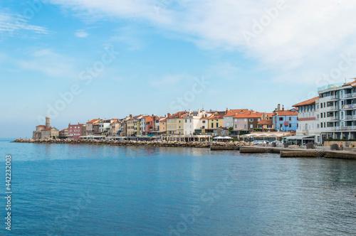 Fototapeta Naklejka Na Ścianę i Meble -  A panoramic of old historical Adriatic city of Piran, Slovenia. View over the tiled roofs of Piran and the Adriatic Sea.