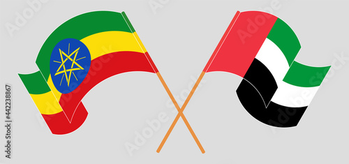Crossed and waving flags of Ethiopia and the United Arab Emirates