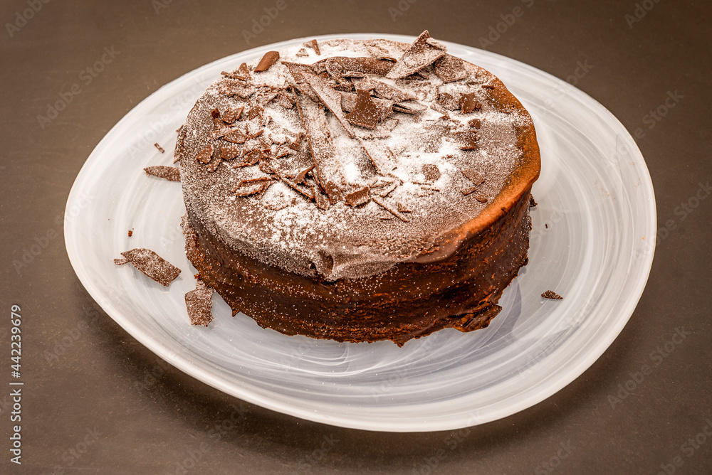 wonderful cake with three chocolates in different textures sprinkled with icing sugar wonderful cake with three chocolates in different textures sprinkled with icing sugar