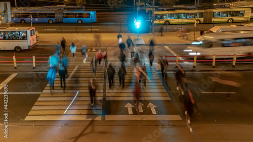 The crowd of people in the queue for the bus at rush hour in the end of the working day