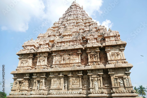 Carved friezes and niches are covered with religious carvings photo