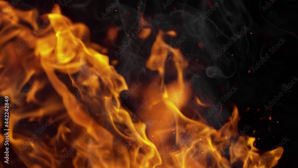 Super Slow Motion Shot of Flames, Smoke and Sparks Isolated on Black Background at 1000fps. Super Slow Motion Shot of Flames, Smoke and Sparks Isolated on Black Background at 1000fps.