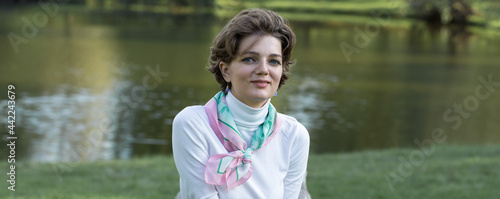 Fototapeta Naklejka Na Ścianę i Meble -  Young woman in the park. Cute girl portrait in french style.