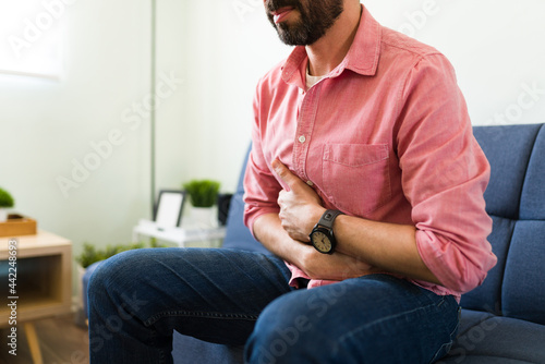 Tableau sur toile Close up of a man suffering indigestion