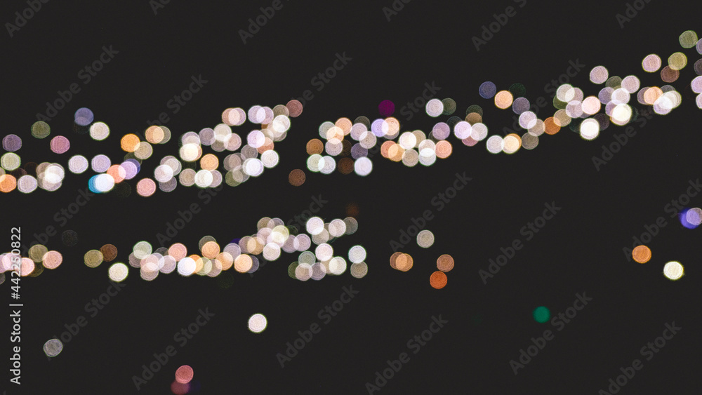 Beautiful blurry lights (bokeh effect) of the phones of the public attending a great concert in a stadium Beautiful blurry lights (bokeh effect) of the phones of the public attending a great concert in a stadium
