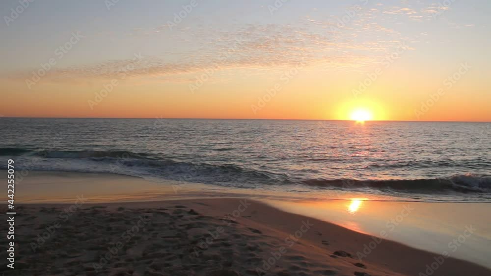 Golden Sunset Over Ocean And Gentle Waves - Panning Right Shot