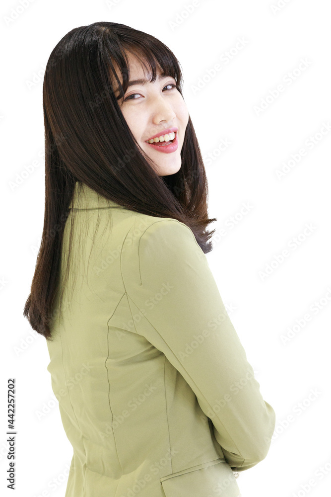 Vertical side view close-up portrait shot of cute smiling young adult Asian woman in light green suit looking at the camera isolated with white background. Concept of successful businesswoman Vertical side view close-up portrait shot of cute smiling young adult Asian woman in light green suit looking at the camera isolated with white background. Concept of successful businesswoman