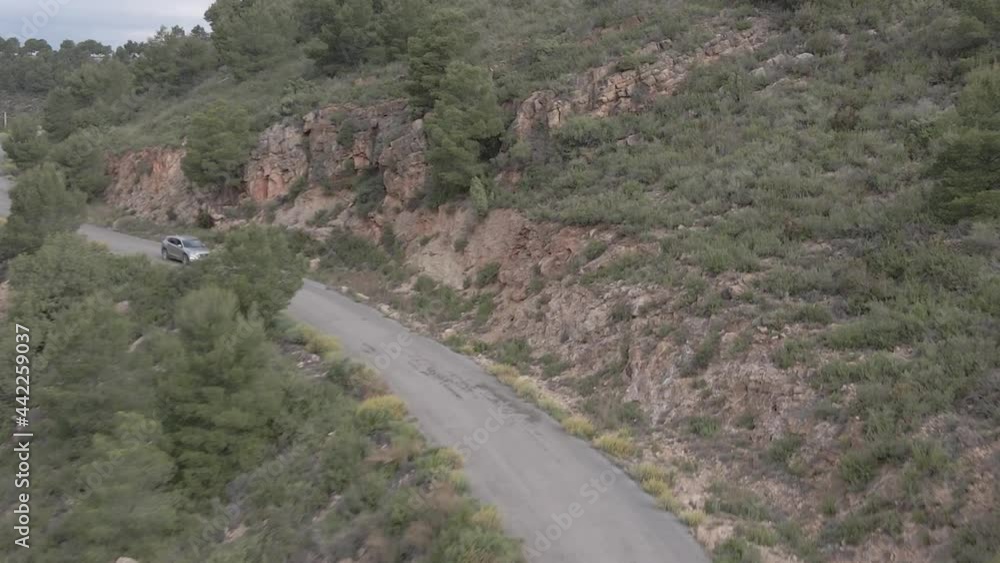Car drive along meandering roads of Serra Calderona, Valencia, Spain. Aerial shot Car drive along meandering roads of Serra Calderona, Valencia, Spain. Aerial shot