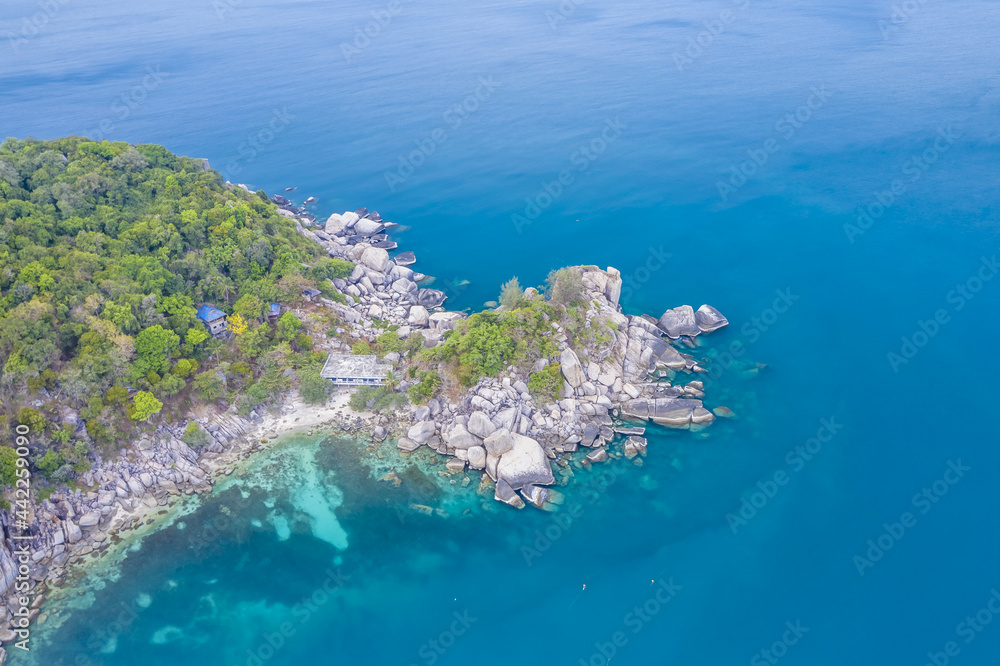 Clean Clear Blue Ocean Sea Water with rocks beach no people copy space paradise tropical island beautiful Koh Tao Thailand drone ariel aerial uav