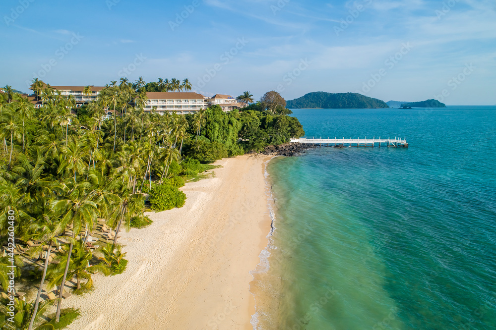 Coastline in Southern Thailand aerial drone uav high altitude landscape over the sea and land and mountains with sunny weather and clouds with turquoise water and copy space