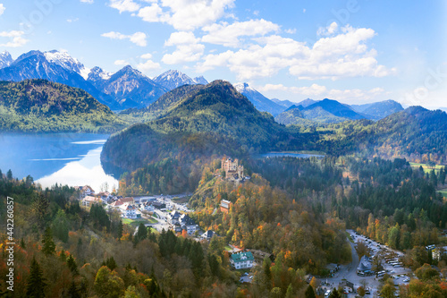 Landscape with Hohenschwangau Castle  Bavaria  Germany. Beautiful panorama of mountain lakes. Scenery of Alpine nature in autumn. Aerial scenic view of village in Alps.