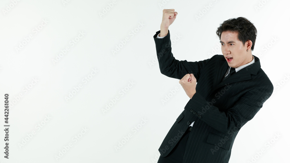 Portrait of self-confidence young and handsome Asian businessman in black suit standing and clench his hands in trust gesture, copy space studio shot isolated on white background Portrait of self-confidence young and handsome Asian businessman in black suit standing and clench his hands in trust gesture, copy space studio shot isolated on white background