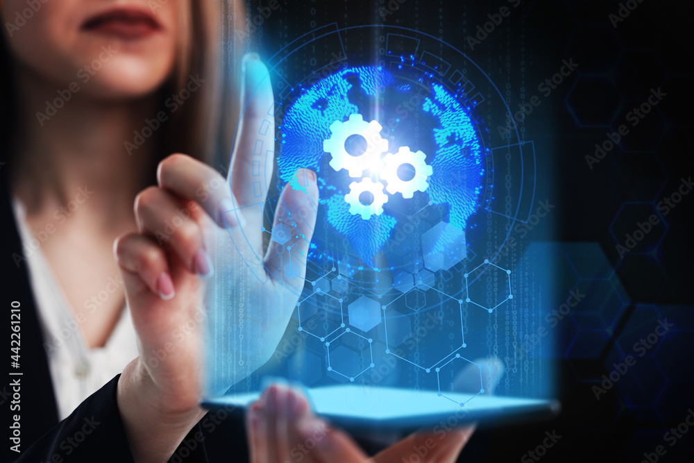 Business, Technology, Internet and network concept. Young businessman working on a virtual screen of the future and sees the inscription: Business, Technology, Internet and network concept. Young businessman working on a virtual screen of the future and sees the inscription: