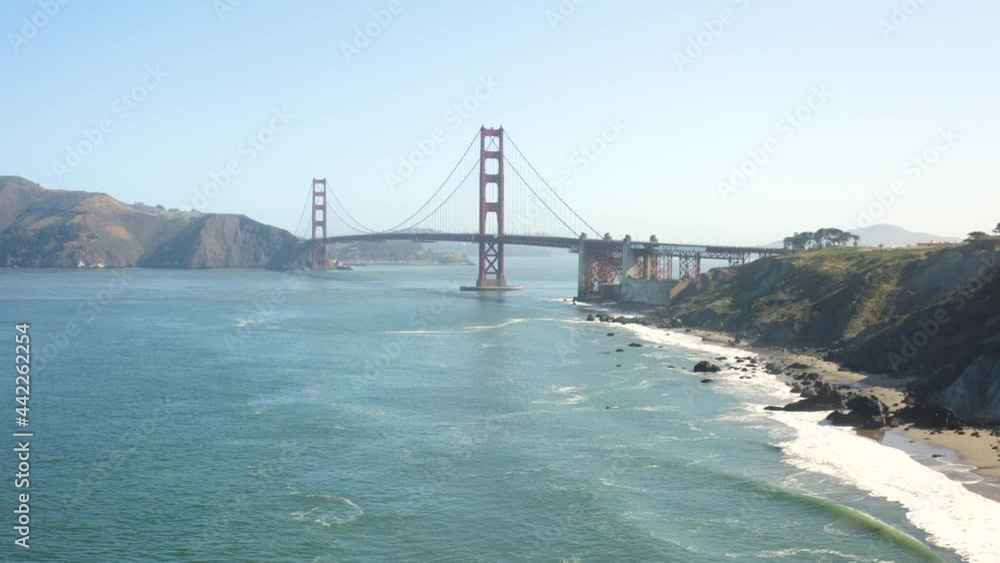 Drone parallax view of rocky beach in front of spectacular Golden Gate Bridge Drone parallax view of rocky beach in front of spectacular Golden Gate Bridge