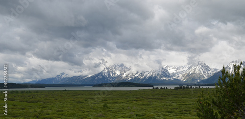 Spring in Grand Teton National Park: Gray Skies over Jackson Lake, Donoho Point Island and Grand Teton, Mount Saint John, Mount Woodring & Mount Moran of the Teton Range Seen From Jackson Lake Lodge