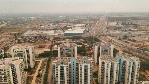 Travelling front, drone, Centrality of Zango, Luanda, Angola, Africa,  social contrasts, harsh realities today, in the background the expressway, Fidel Castro avenue photo