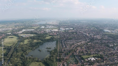 Wallpaper Mural High drone shot of long straight train tracks separating UK town from natural reserve Torontodigital.ca