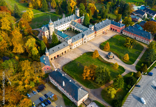 Scenic aerial view of historical neo-gothic Sychrov castle with colorful fall park, Czech Republic © JackF