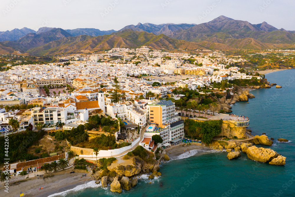 Picturesque summer view from drone of coastal Mediterranean town of Nerja, Axarquia, Andalusia, Spain.