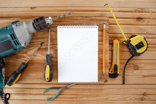 Set of different building equipments on the wooden table