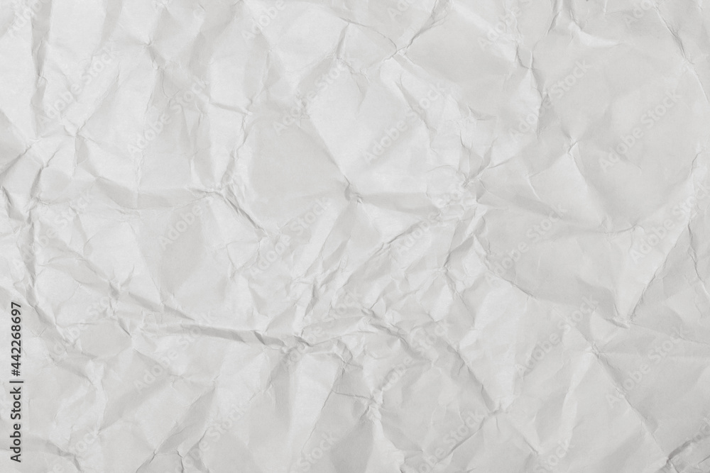 Crumpled white paper texture, close up. Crumpled white paper texture, close up.