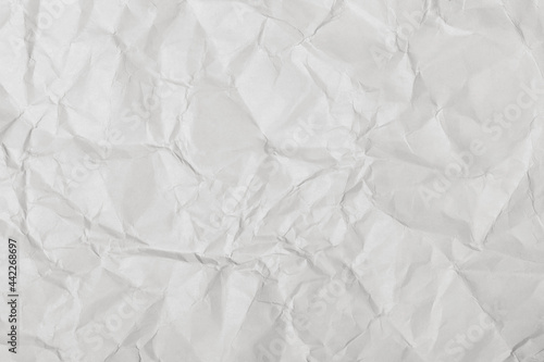 Crumpled white paper texture, close up.