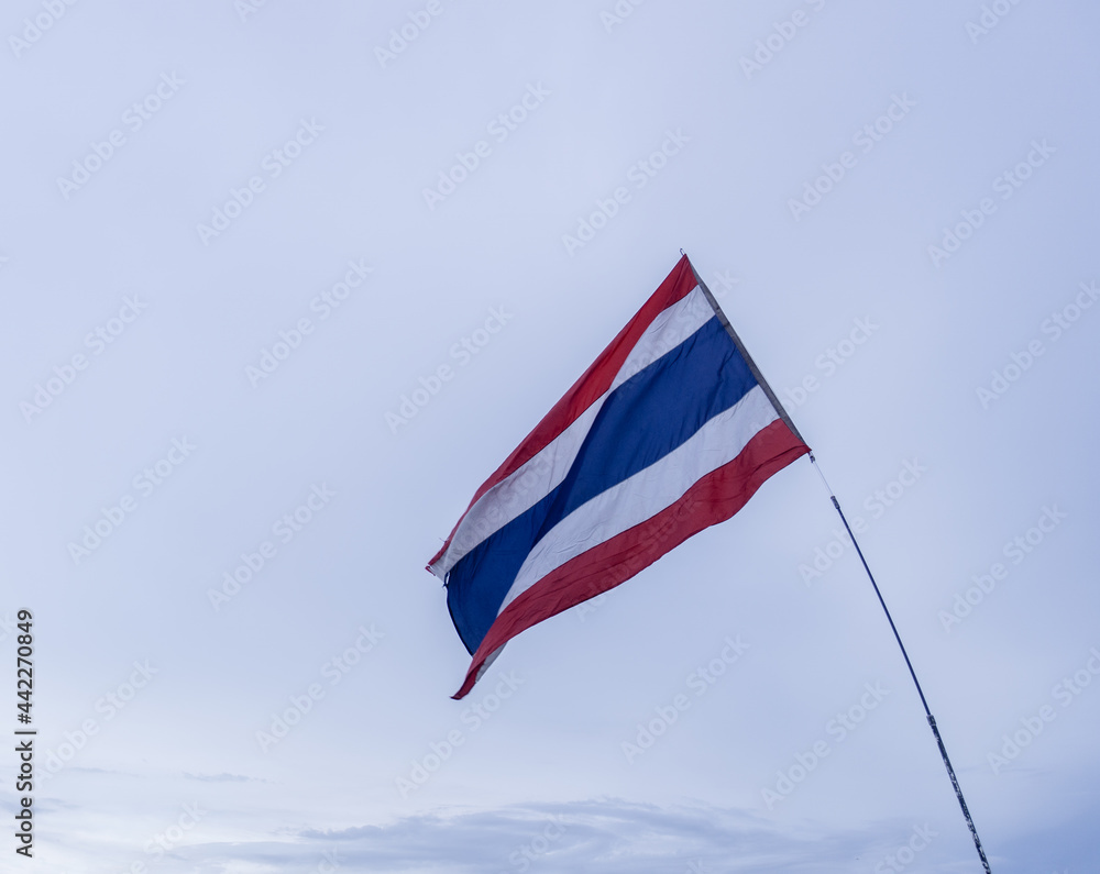 National flag of Thailand waving in cloudy sky National flag of Thailand waving in cloudy sky
