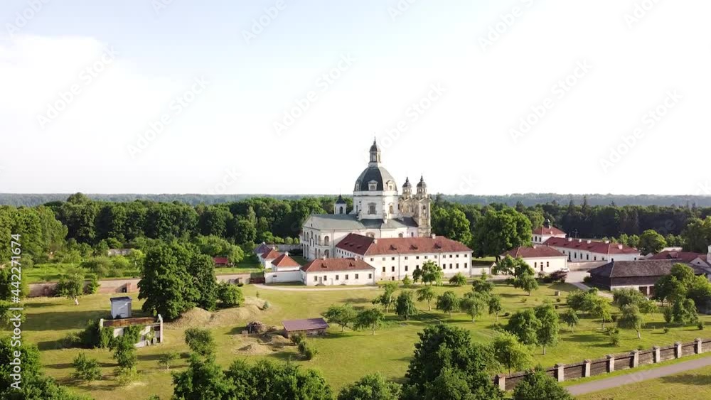 Pazaislis monastery complex building with majestic dome in descend behind bush drone view Pazaislis monastery complex building with majestic dome in descend behind bush drone view