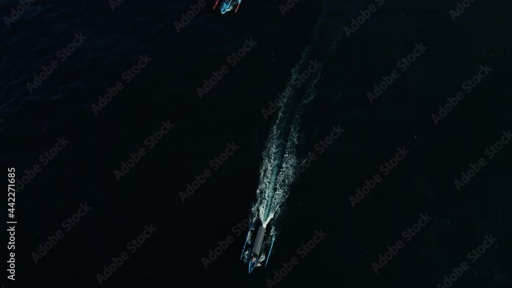 Two fisherman motorized boats sailing in ocean Bali Indonesia. High quality 4k aerial footage Two fisherman motorized boats sailing in ocean Bali Indonesia. High quality 4k aerial footage