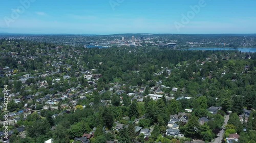 Drone flying over Madison Valley in Seattle with views of University of Washington, Fremont, Ballard, Queen Anne, Lake Union and Lake Washington. photo