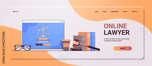 law and justice concept gavel judge books and scales on laptop screen online lawyer legal advice