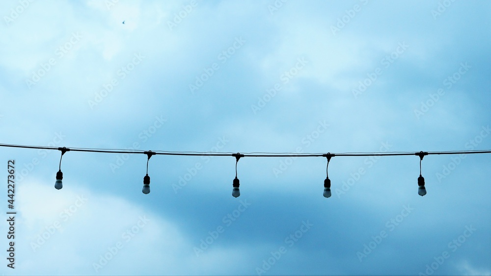 lamp on a rope with sky background lamp on a rope with sky background