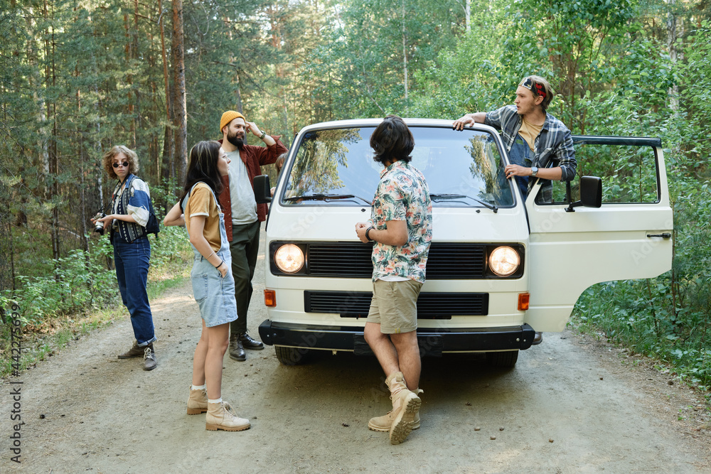 Group of friends travelling by van together they going to camping together Group of friends travelling by van together they going to camping together